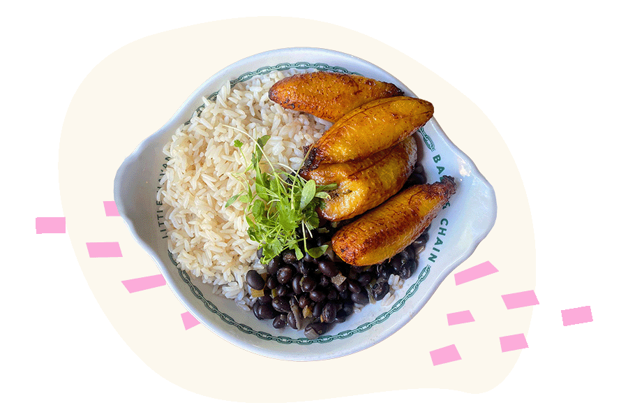 A plate with rice, beans and fried plantains on a Miami Food Tour.