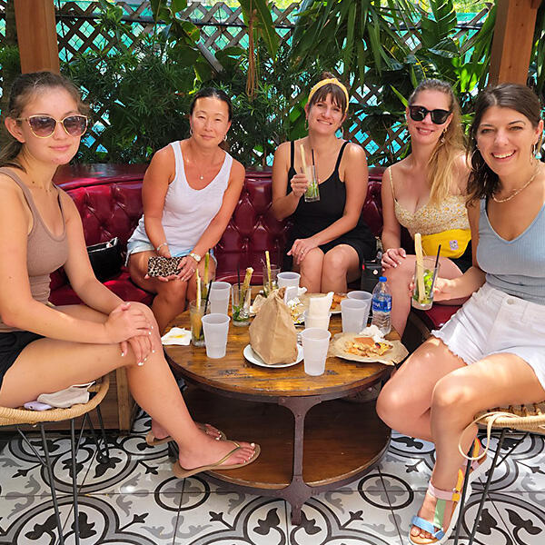 A group of women enjoying a private experience at a table during a Miami Food Tour.