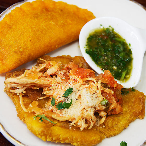 A culinary delight served on a white plate amidst the vibrant atmosphere of Little Havana.