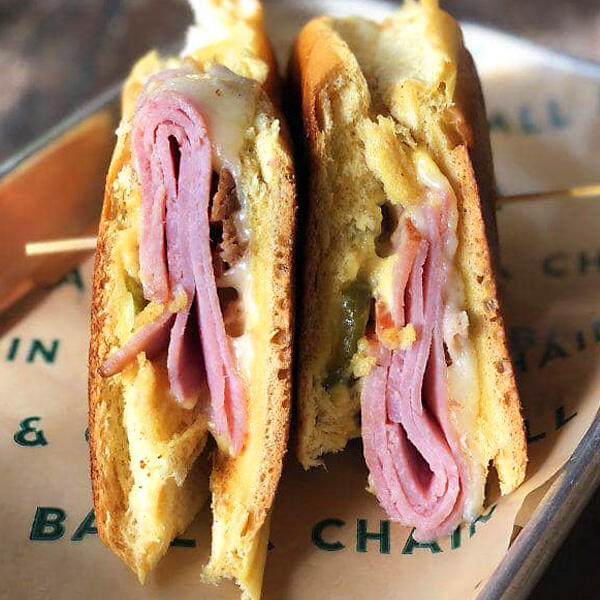 A sandwich with ham and cheese on top, perfect for private tours.