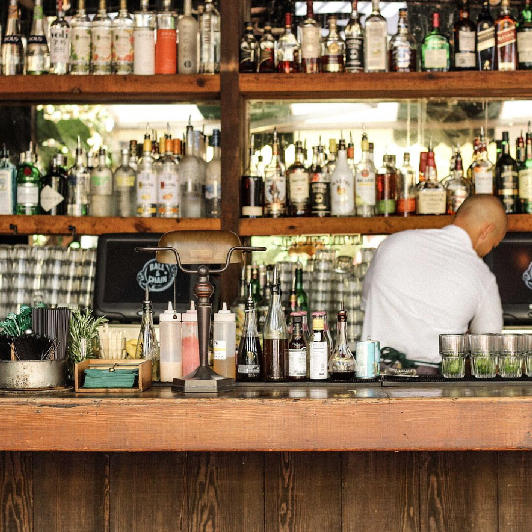 A man behind the bar at a restaurant specializing in Miami Food Tours.