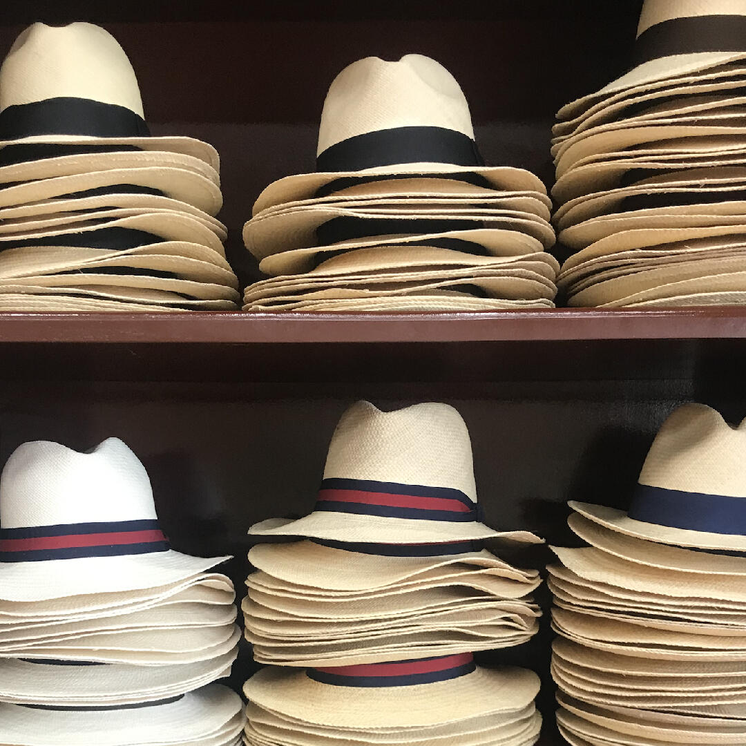 Many hats are stacked on a shelf at Cullenary Tours.