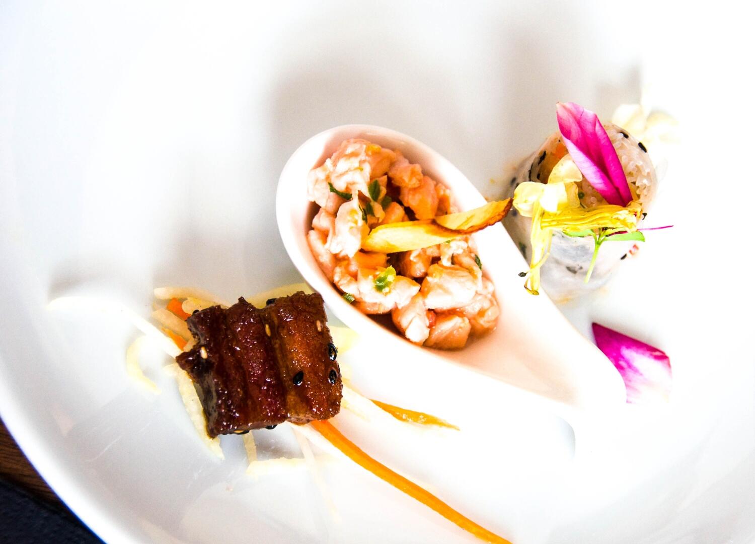 A plate with food on it at a culinary tour in Miami.