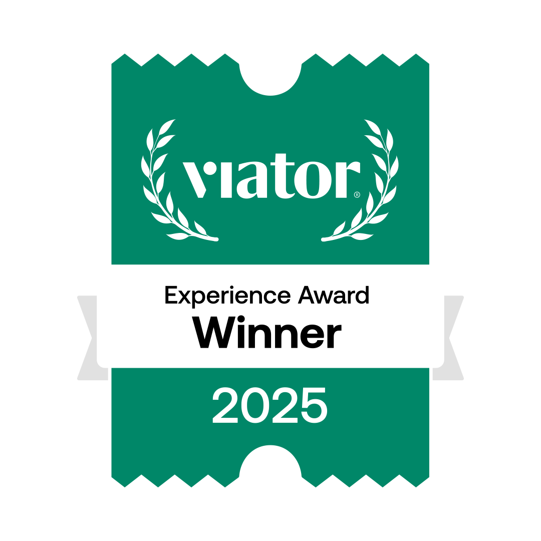 Green badge displaying "Viator Experience Award Winner 2025" with laurel graphics and a ticket-like design.